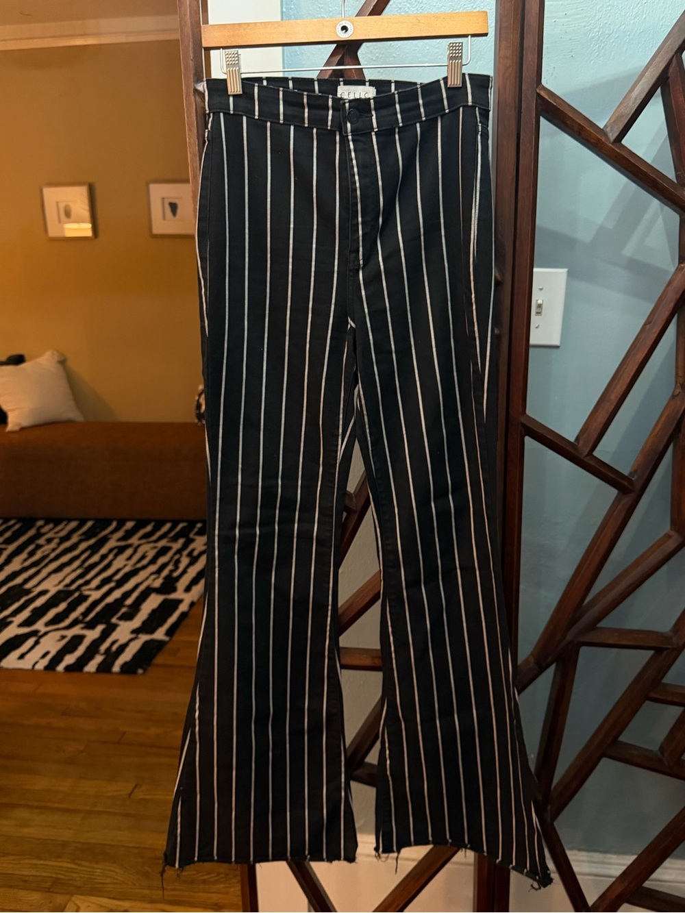 Black flare jeans with white pinstripes
